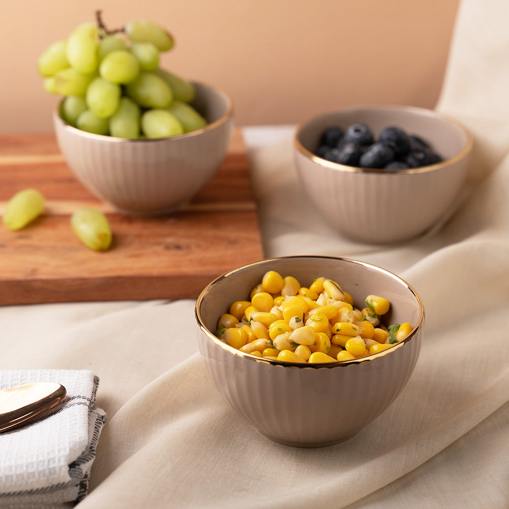 Elegant Beige Ceramic Bowl Set with Golden Rim – 4 Pcs